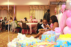 Plenty of gifts at baby shower event.