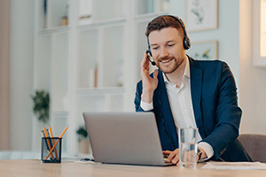 Businessman smiling while consulting with client on finishing touches